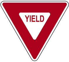 <p><strong>A red and white triangular sign at an intersection means…?</strong></p>