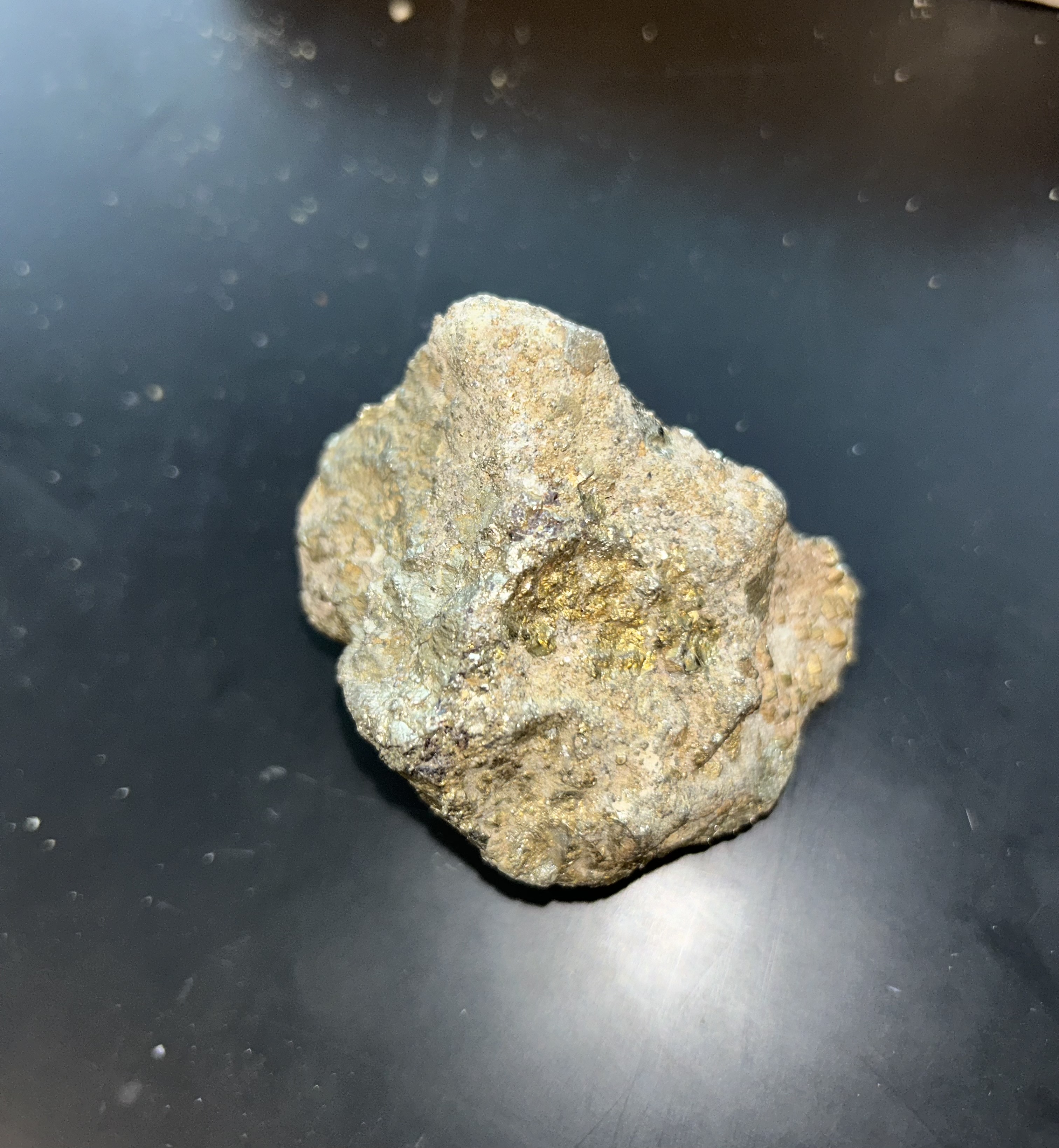 <p><strong>brassy metallic luster, black streak, brittle fracture, hardness greater than that of glass, absence of cleavage and it is nonmagnetic</strong></p>