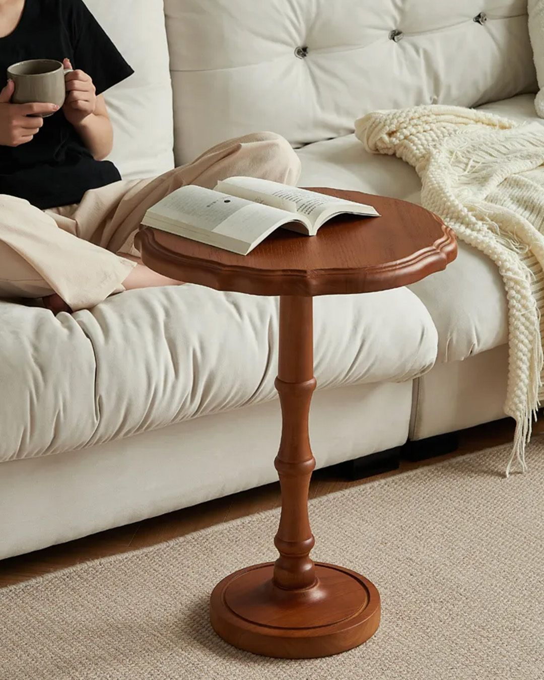 <p>reach for <strong><u>a book</u></strong> on <strong><u>the end table</u></strong></p>