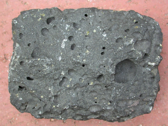 <ol><li><p>extrusive origin</p></li><li><p>vesicular texture</p></li><li><p>composition mafic</p></li></ol><p></p>