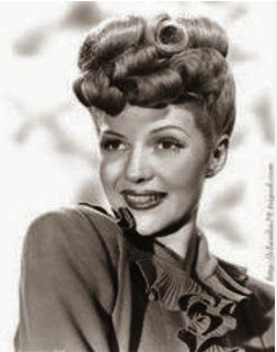 <p>popular 1940s hairstyle with medium-long hair brushed upward from the side and nape of the neck, then secured on top of the head in curls or a pompadour</p>
