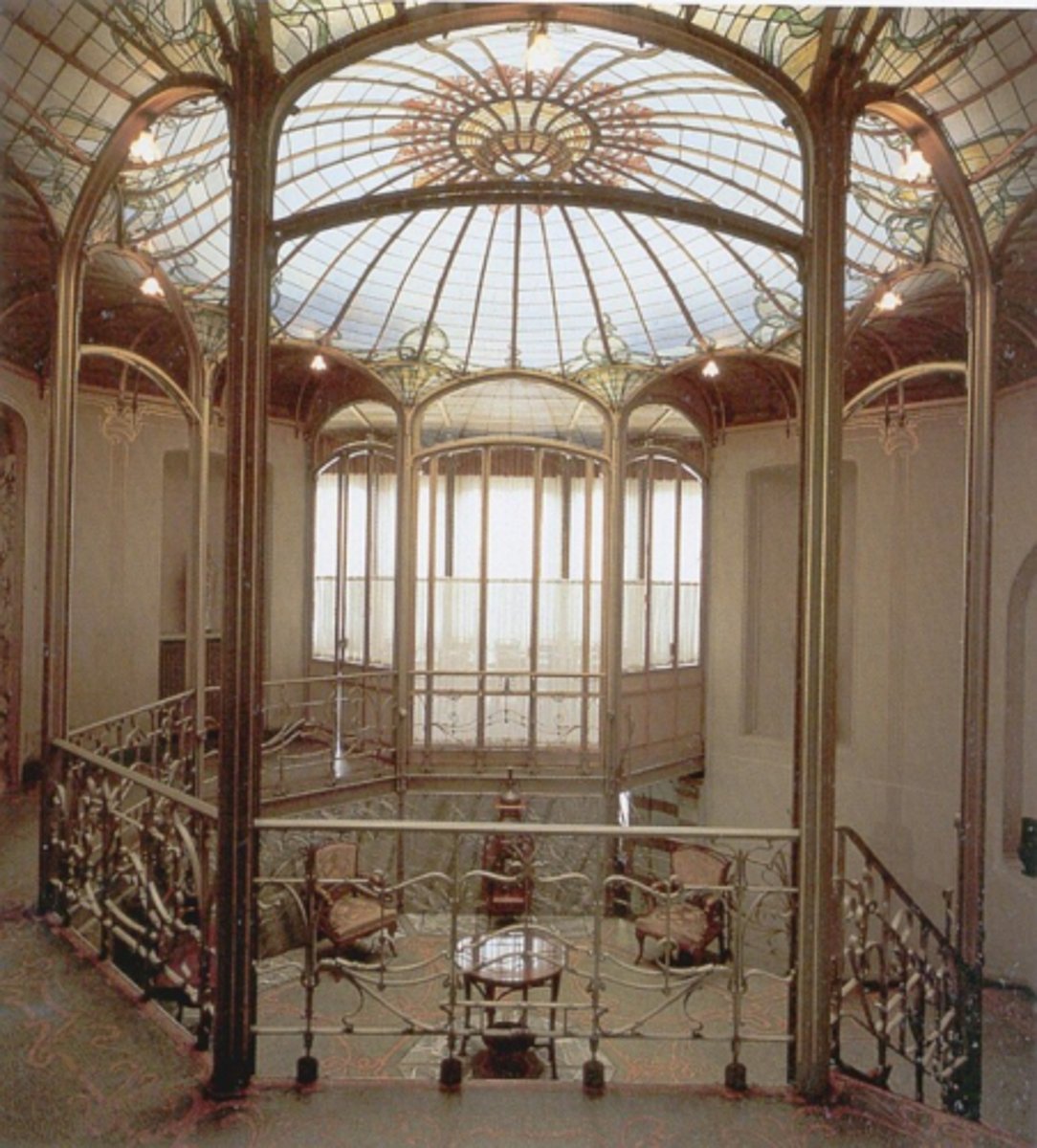 <p>Designed by Victor Horta; His own house with its asymmetrical façade with twisted iron balcony supports and large glass windows, Horta was able to design every detail—furniture, light fixtures, stained- glass panels, door and window frames, even hardware—so that every element is an expression of Art Nouveau, curvilinear, nature- related decorative detail.</p>