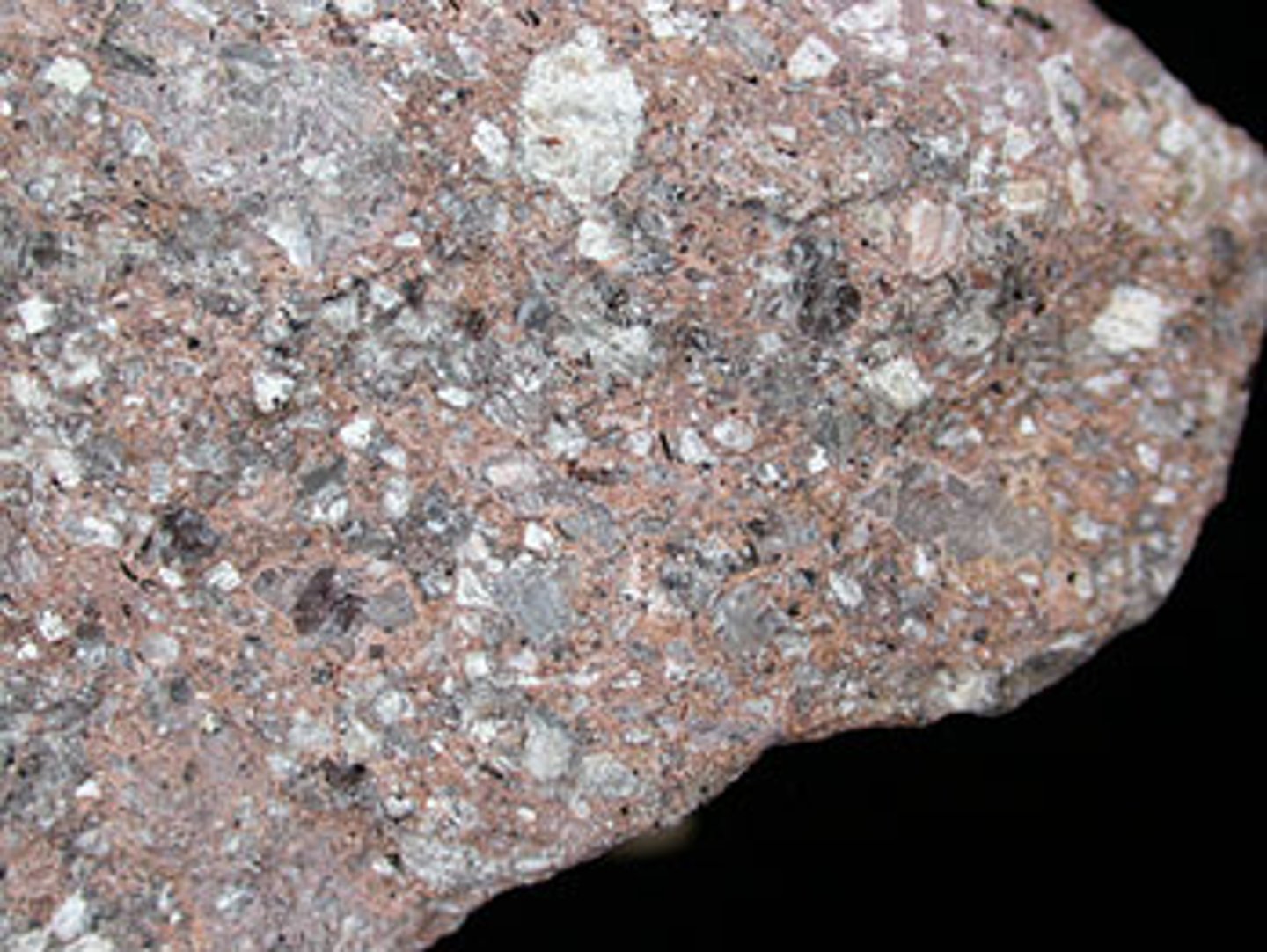 <p>a light-colored, fine-grained, with bits of other minerals throughout.</p>