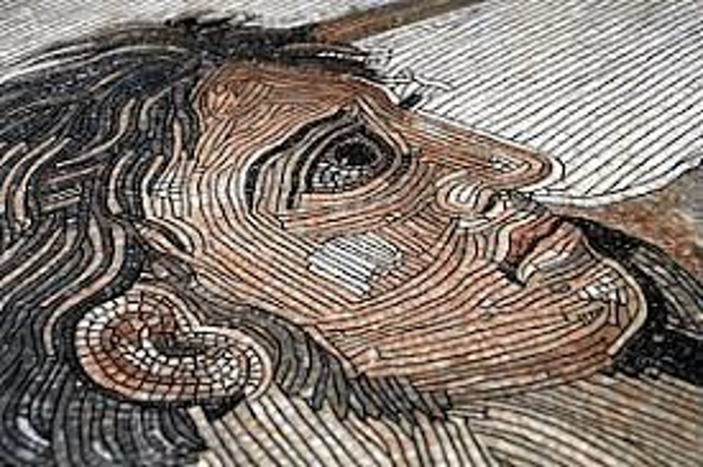 <p>mosaic of tessera arranged in waving lines resembling the form or tracks of worm</p>