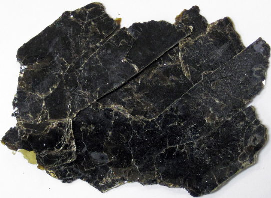<p>“black mica” </p><p>one direction of cleavage </p><p>peels off in this sheets </p><p>almost greenish </p><p>flexible </p>