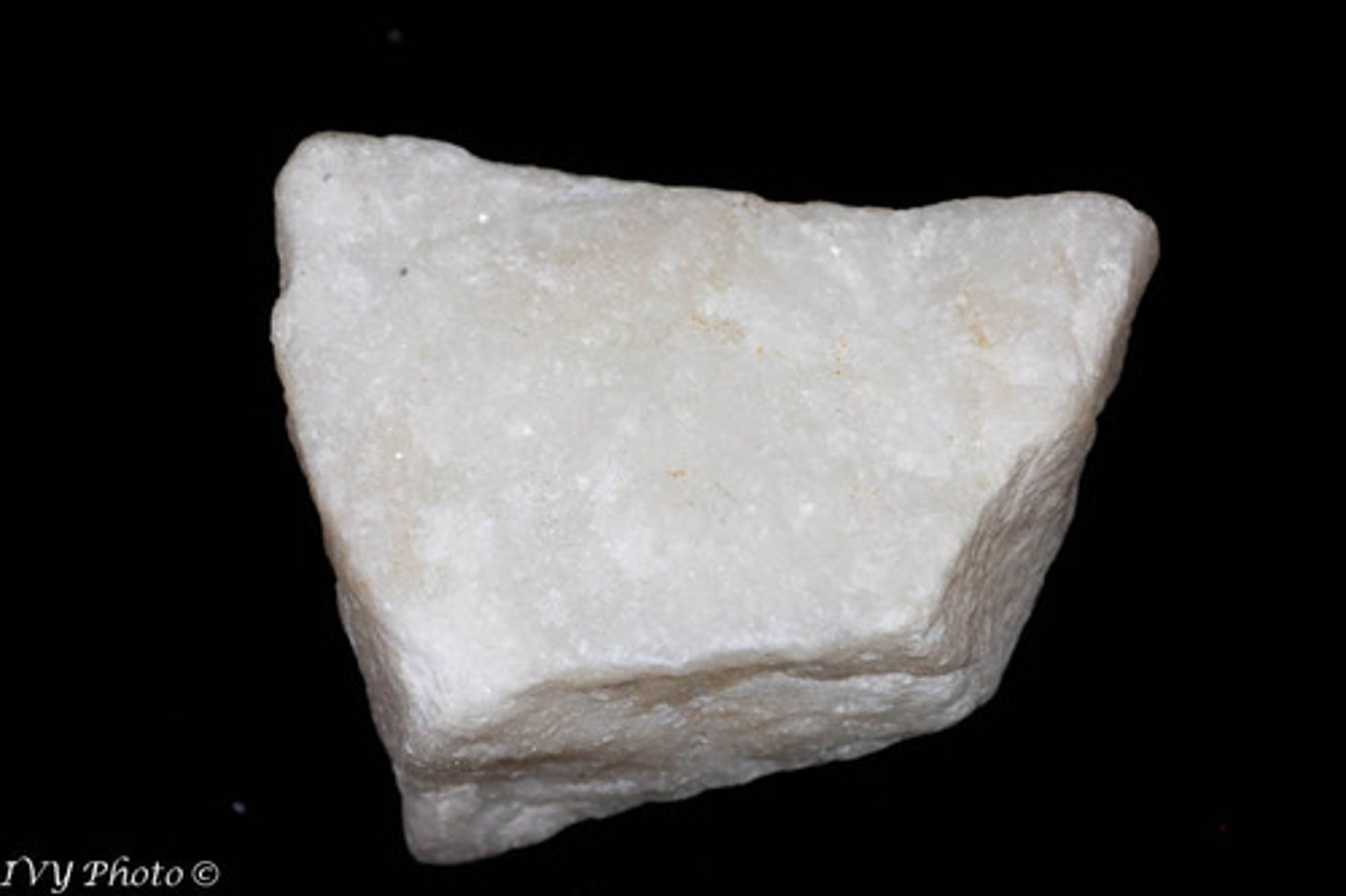 <p>Rock-forming mineral; hardness 3.5-4, white, gray, or buff, three cleavages, only reacts with dilute acid when mineral is crushed into powder</p>