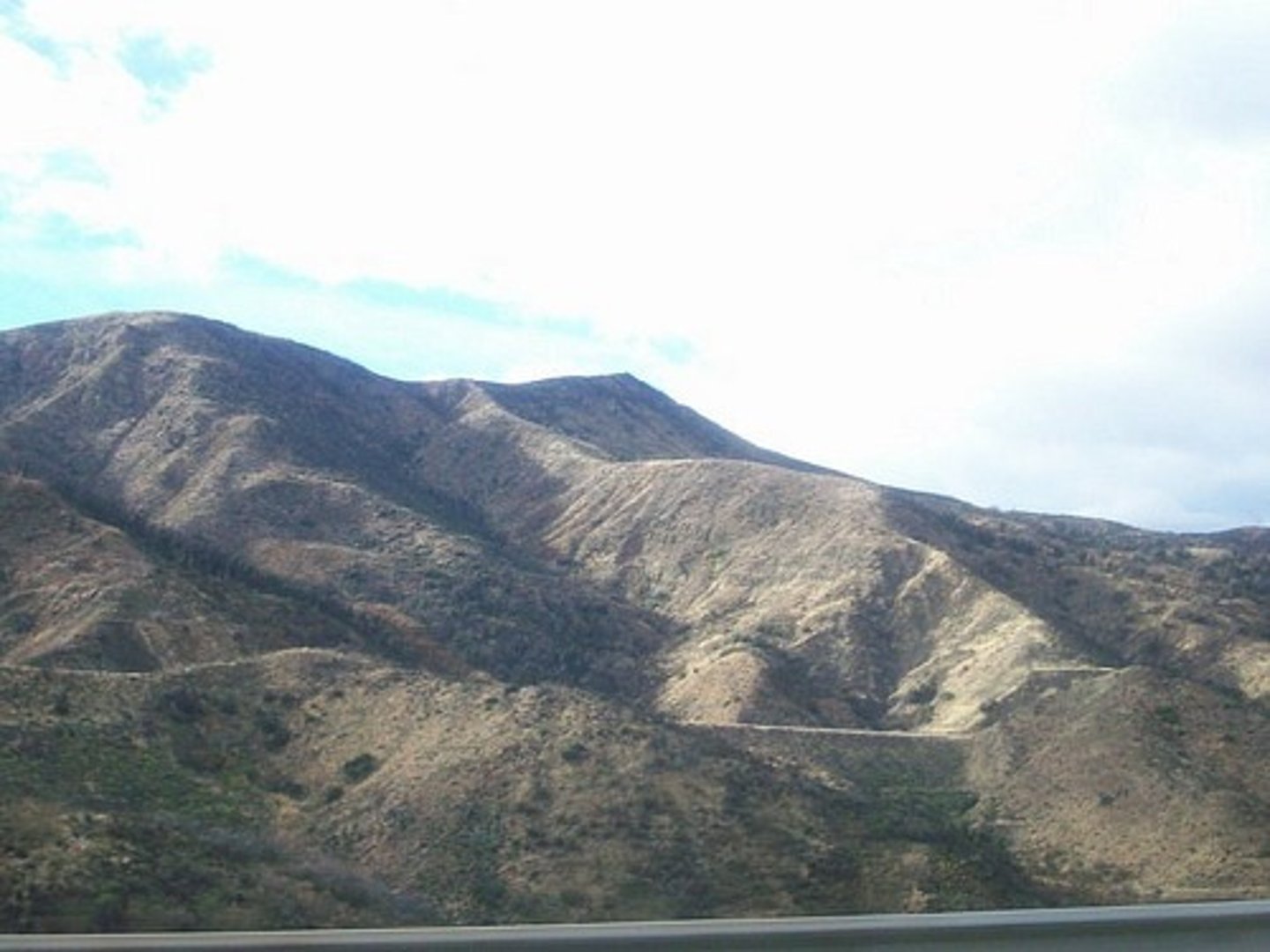 <p>the top of a mountain or high hills that separate where water flows</p>