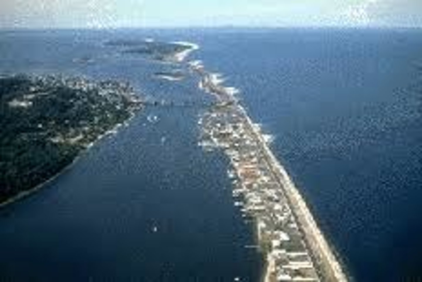 <p>depositional feature; ridges of sand that run parallel to the coast, separated by lagoon</p>