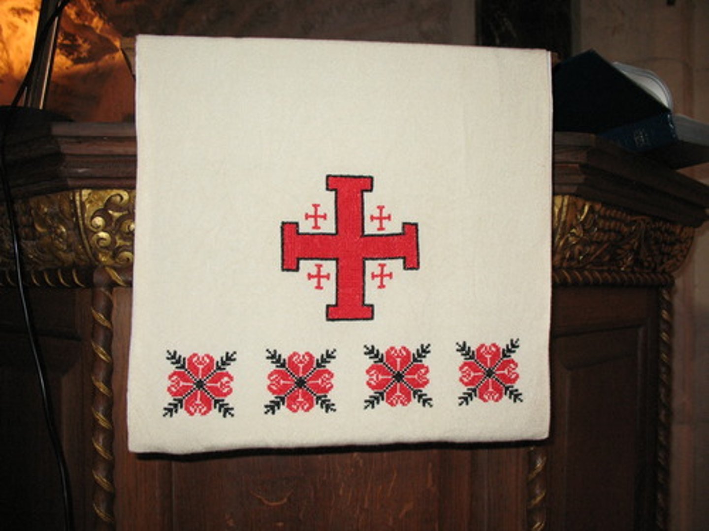 <p>a cross whose four arms each terminate in a crossbar, often with a small Greek cross centered in each quadrant</p>