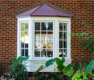 <p>a window that projects from the surface of a wall to allow light from three sides</p>