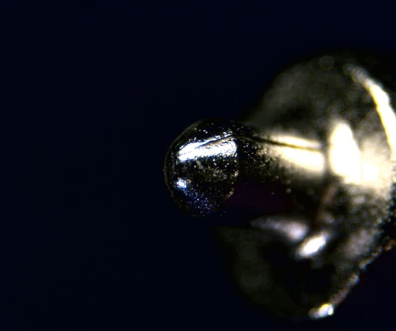 <p>What type of machining often creates seams in metal, as seen on this firing pin?</p>