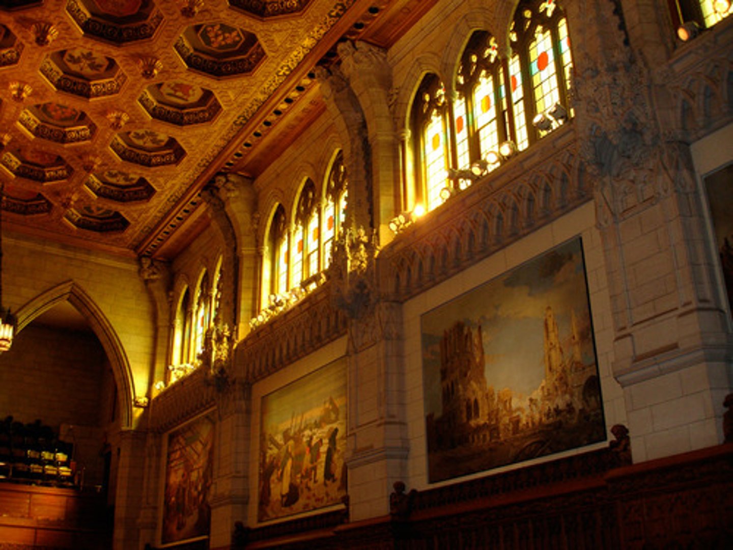 <p>a portion of an interior rising above adjacent rooftops and having windows to admit daylight</p>