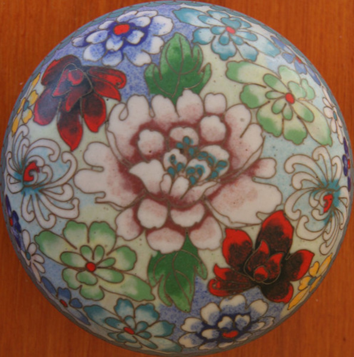 <p>enameling technique where thin wire partitions (cloisons) are filled with enamel (art form from ancient Byzantium)</p>
