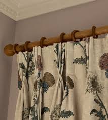 <ul><li><p>with drapery hanging just below the pole with rings, </p></li><li><p>Large poles can be brass, painted or stained wood, whirred with fabric, with decorative end finials, </p></li><li><p>1 ½ diameter for brass and 1 3/8 for wood w/ 2 rings </p></li></ul><p></p>