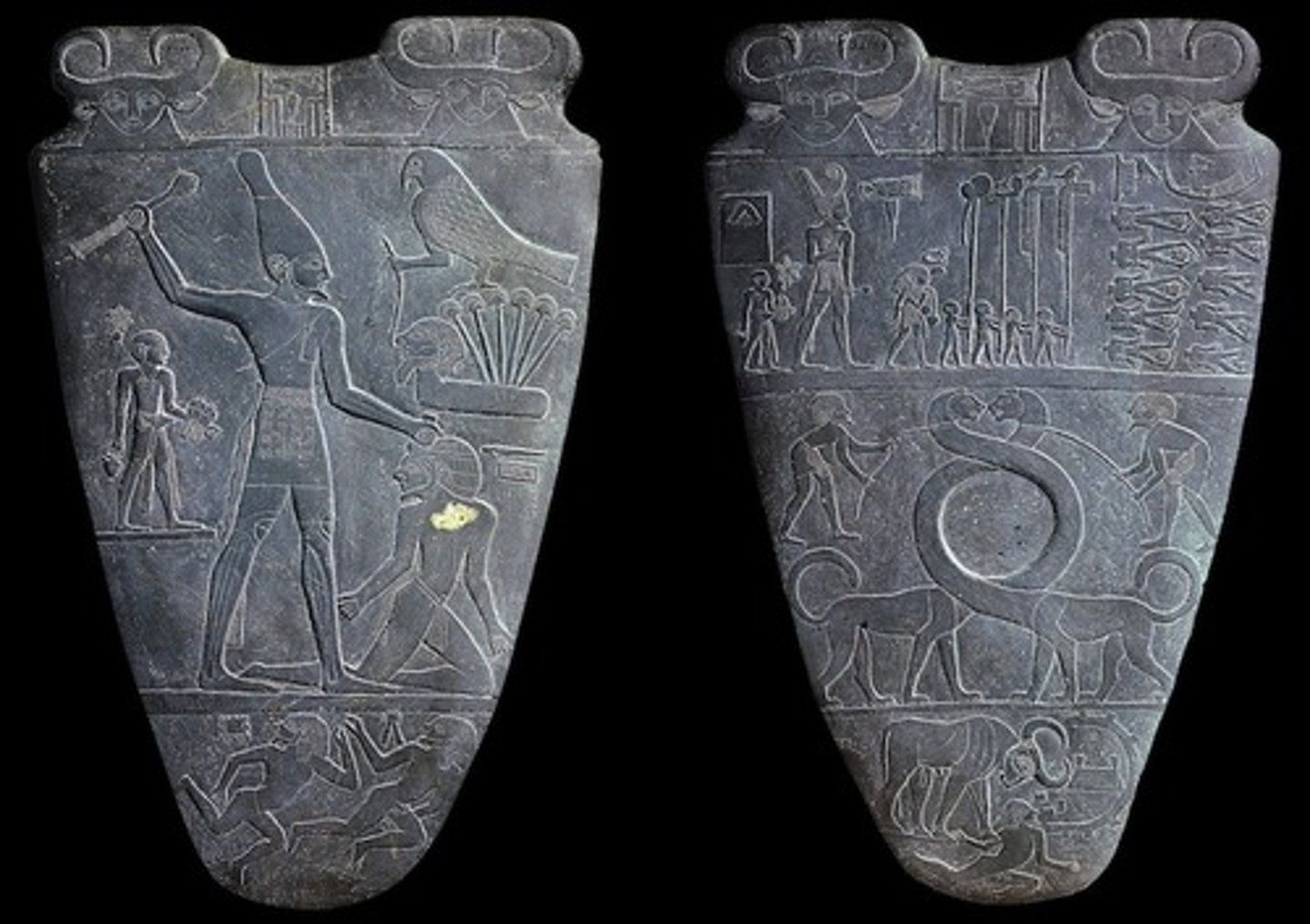 <p>Predynastic Egypt, 3500-3000 BC. Possible represents unification under Narmer. King in smiting pose. Hathor (fertility god) and Horus (falcon god and god of upper Egypt) shown. Malachite crushed in palette used as medicine? Cartouche emblem, organized in registers.</p>