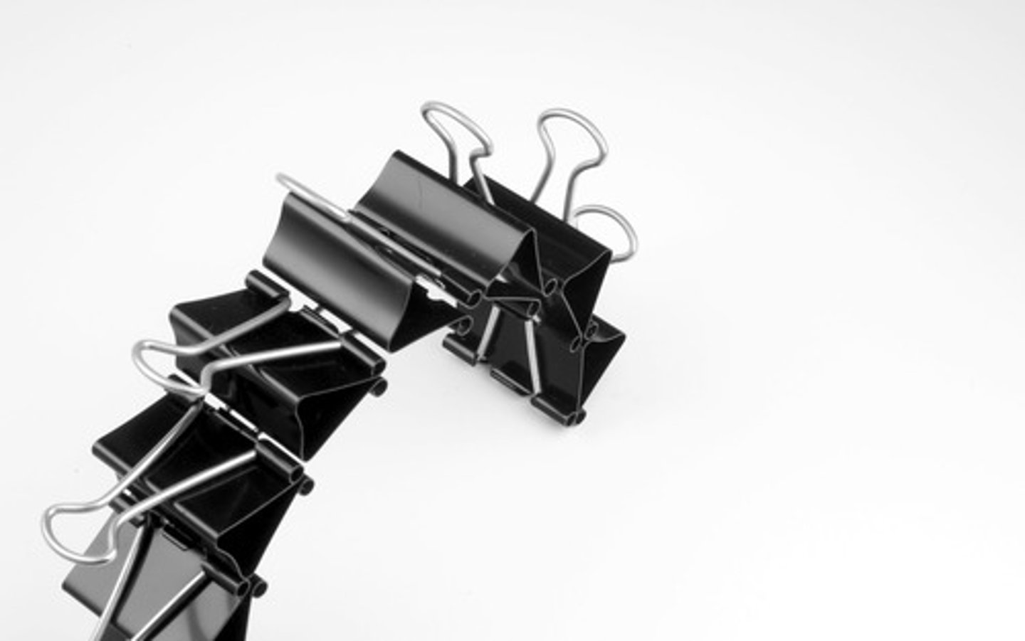 <p>(n.) a metal holder used for keeping things together</p>