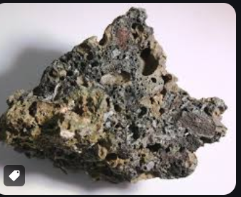 <p>is a texture in igneous rocks characterized by the presence of spherical cavities or vesicles formed by gas bubbles escaping during solidification. </p>