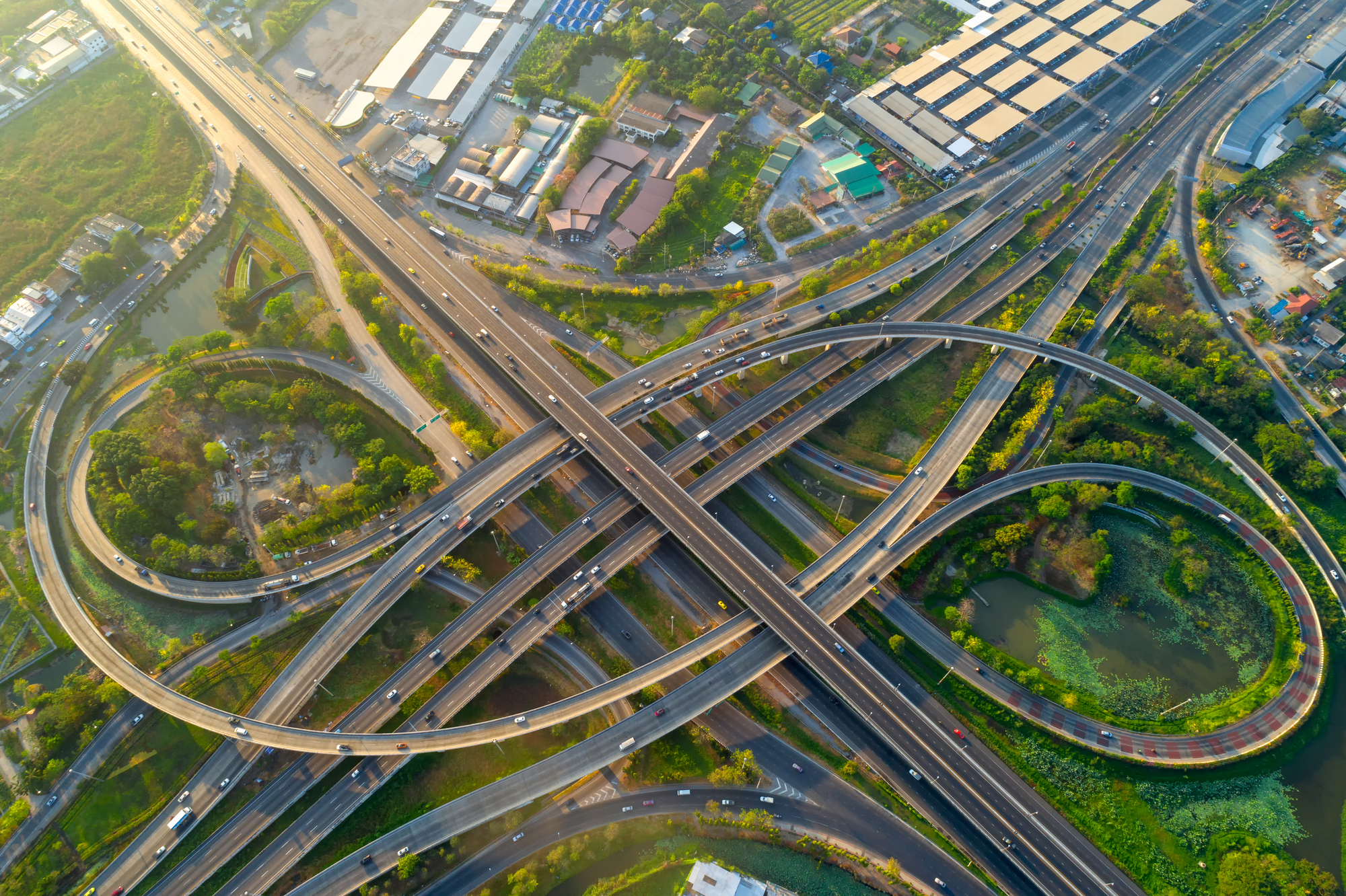 <p>a junction where two or more highways meet, allowing vehicles to change direction or access different routes without stopping. </p>