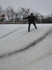 The water acts as a lubricant on an already slippery surface.