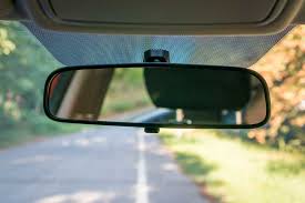 <p><span>a mirror inside the car that gives the driver a view of the area behind the car</span></p>