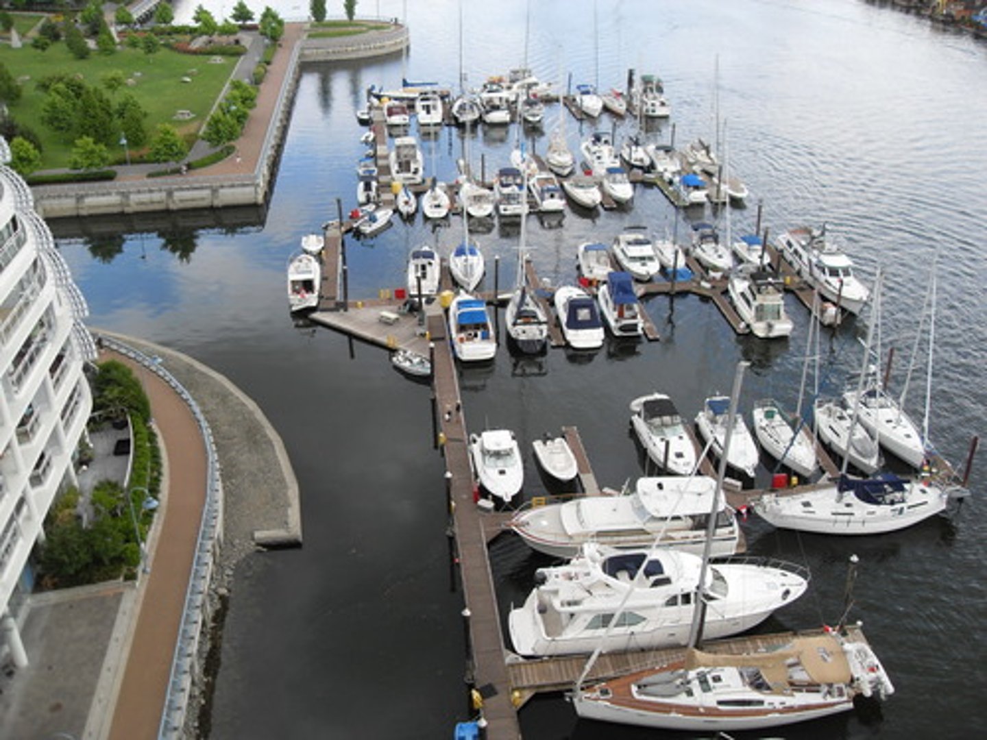 <p>an area of water near the coast where ships are kept and are safe from the sea</p>