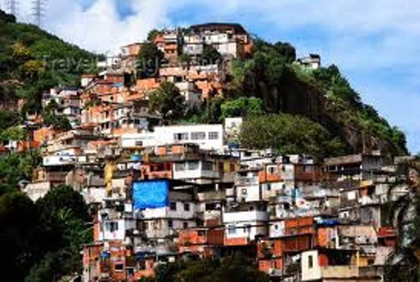 <p>An area within a city in a less developed country in which people illegally establish residences on land they do not own or rent and erect homemade structures.</p>