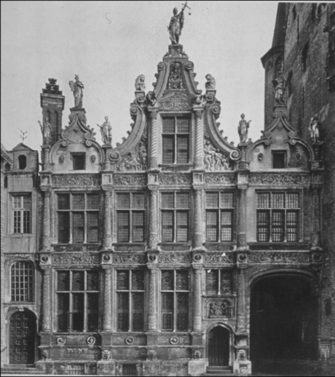 <p>a Baroque townhouse has mullioned &amp; transomed windows, a central gable, crockets &amp; figures</p>