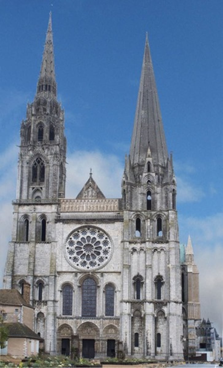 <ul><li><p><span style="background-color: transparent;"><span>church dedicated to the Virgin Mary existed at Chartres by the 4th century</span></span></p></li><li><p><span style="background-color: transparent;"><span>Romanesque cathedral was built in the 11th century but later destroyed by a fire</span></span></p></li><li><p><span style="background-color: transparent;"><span>current Gothic cathedral rose rapidly after the fire, funded by donations from across France due to importance as a Marian shrine</span></span></p></li><li><p><span style="background-color: transparent;"><span>housed the Sancta Camisia, a relic believed to be tunic worn by the Virgin Mary at Christ’s birth, making it a major pilgrimage destination</span></span></p></li><li><p><span style="background-color: transparent;"><span>cross plan, with a long nave, wide transept, and deep choir</span></span></p></li><li><p><span style="background-color: transparent;"><span>Flying buttresses support high walls, allowing vast stained glass windows</span></span></p></li><li><p><span style="background-color: transparent;"><span>Sculptures of kings, queens, prophets, and Christ in Majesty, links Old Testament and New Testament</span></span></p></li><li><p><span style="background-color: transparent;"><span>Famous Blue of Chartres color in Marian windows</span></span></p></li></ul><p></p>