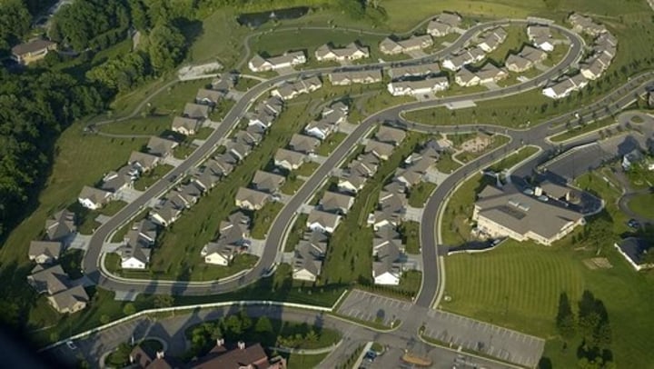 <p>Small communities lying beyond the suburbs of a city</p>