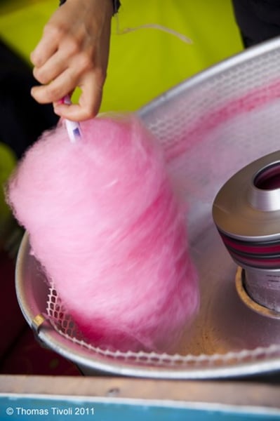 <p>a type of sweet in the form of a mass of sticky threads made from melted sugar and served on a stick, especially at fairgrounds<br>-Women are delicate, like cotton candy. Don't get clumsy, and you'll get to have a taste.</p>