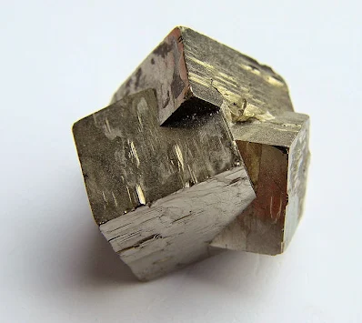 <p>Patchy intergrowths of two crystals with no obvious plane, but related by a twin law.</p>