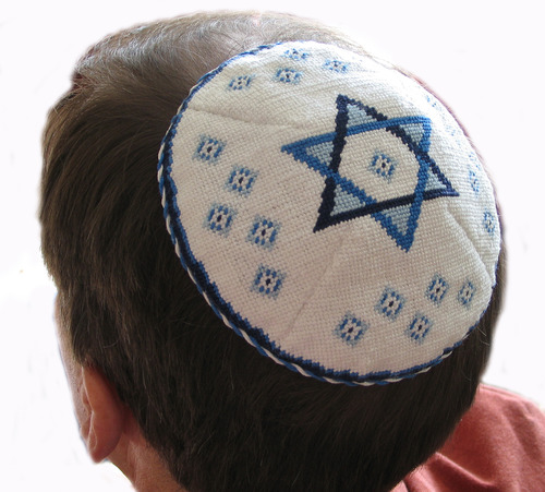 In the Jewish faith, the skull cap worn by the men at temple services and funeral services.