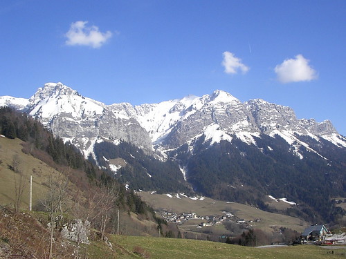 <p>a land form that is very high and steep; They are usually wide at the bottom and rise to a narrow peak or ridge</p>