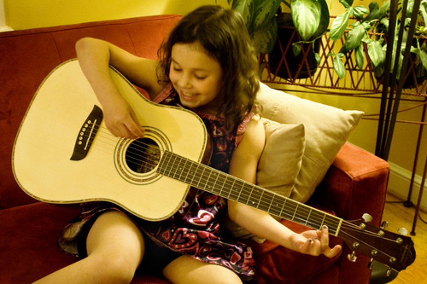 <p>Playing a guitar</p>