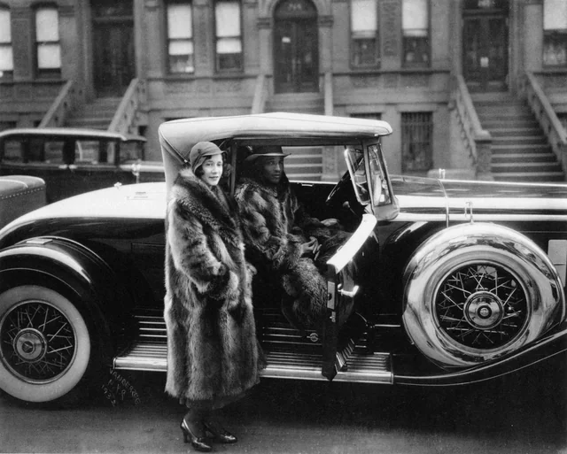 <p>Couple Wearing Raccoon Coats with a Cadillac, 1932</p>