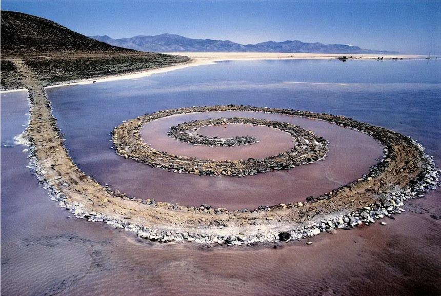 <ul><li><p><strong>ID:</strong> Robert Smithson, 1970 CE, Earthwork (mud, salt crystals, rocks), Utah, USA</p></li><li><p><strong>Content:</strong> A massive spiral-shaped landform extending into the Great Salt Lake.</p></li><li><p><strong>Function:</strong> Emphasizes the relationship between art and nature, ever-changing with the environment.</p></li><li><p><strong>Context:</strong> Part of the Land Art movement, rejecting traditional gallery spaces.</p></li><li><p><strong>Form:</strong> Large-scale, natural materials, organic shape.</p></li></ul><p></p>