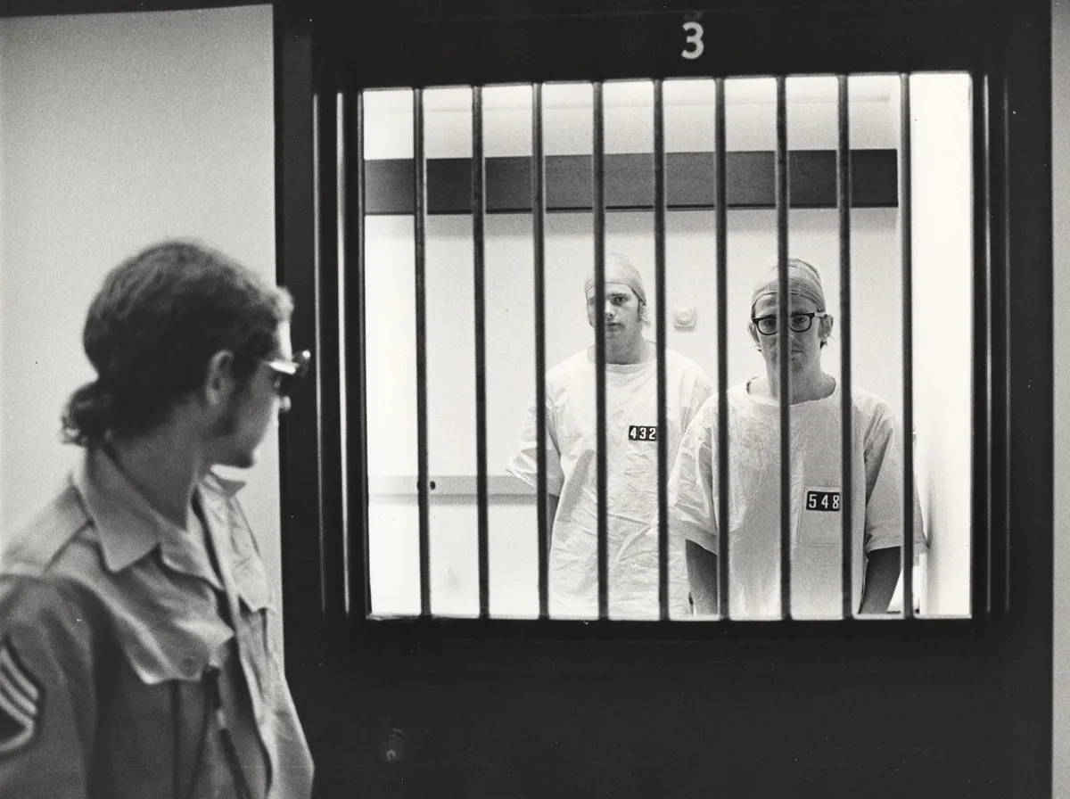 Research Question - What are the psychological effects of a prison?

Participants - 24 male college aged students, who were screened to ensure that they were average.

Procedure - Students were randomly assigned to the prisoner or guard role. Guards were told they had complete authority and to keep prisoners in line, while prisoners were stripped of their individual identity. Zimbardo and his staff of researchers would record behavior.

Results - Some guards became sadistic, while prisoners acted withdrawn and distressed. Study was called off after 6 days, because all participants were absorbed in their roles including Zimbardo.