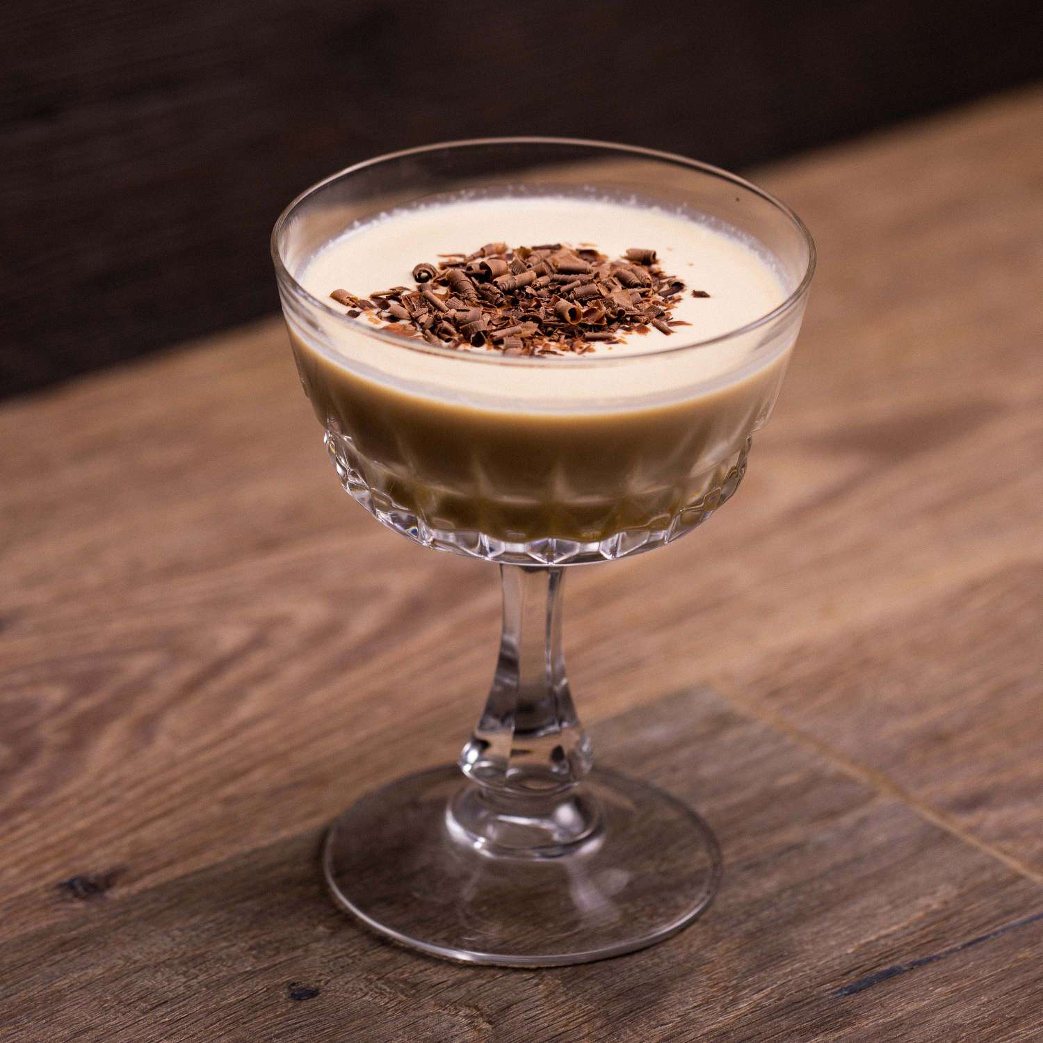 <p>coffee/cream, 1 oz vodka or Irish whiskey, 1 oz coffee liqueur, 1 oz Irish cream, served straight up, no garnish</p>