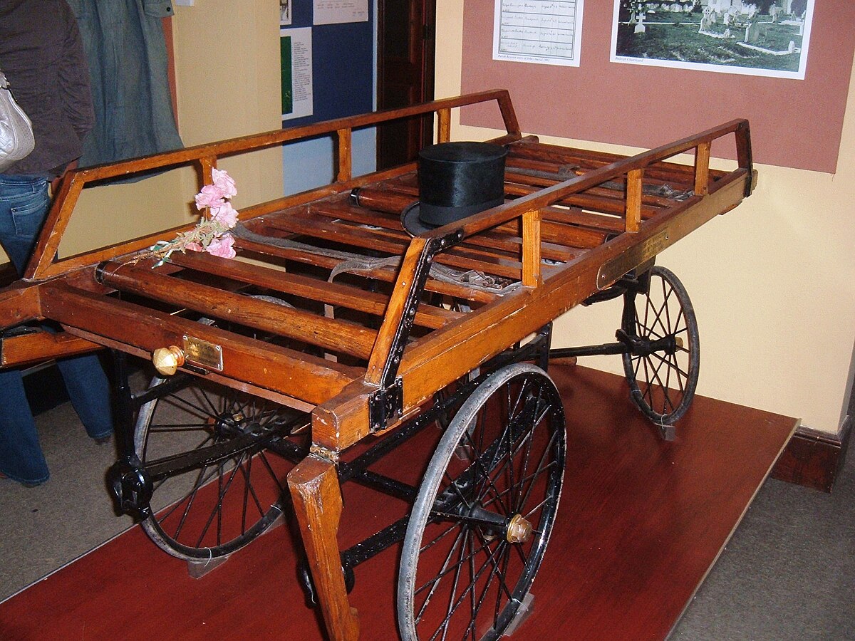 <p>A frame or stand used to support a body during a funeral, typically used for viewing or burial. </p>