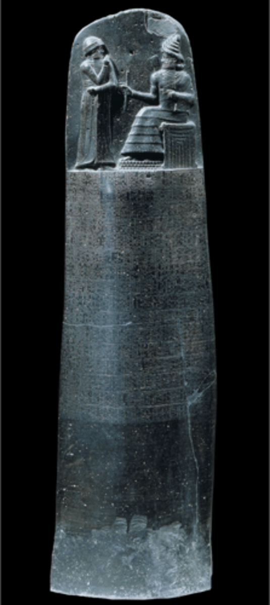 <p>Iran, Old Babylonian, 1780 BC. Shamash (sun and justice god of Mesopotamia) sitting on temple, stone upright with written elements. Law codes governing all aspects of life. Hammurabi raising hand in respect as sun god hands builder's tools to him, signifying his capacity to build social order.</p>