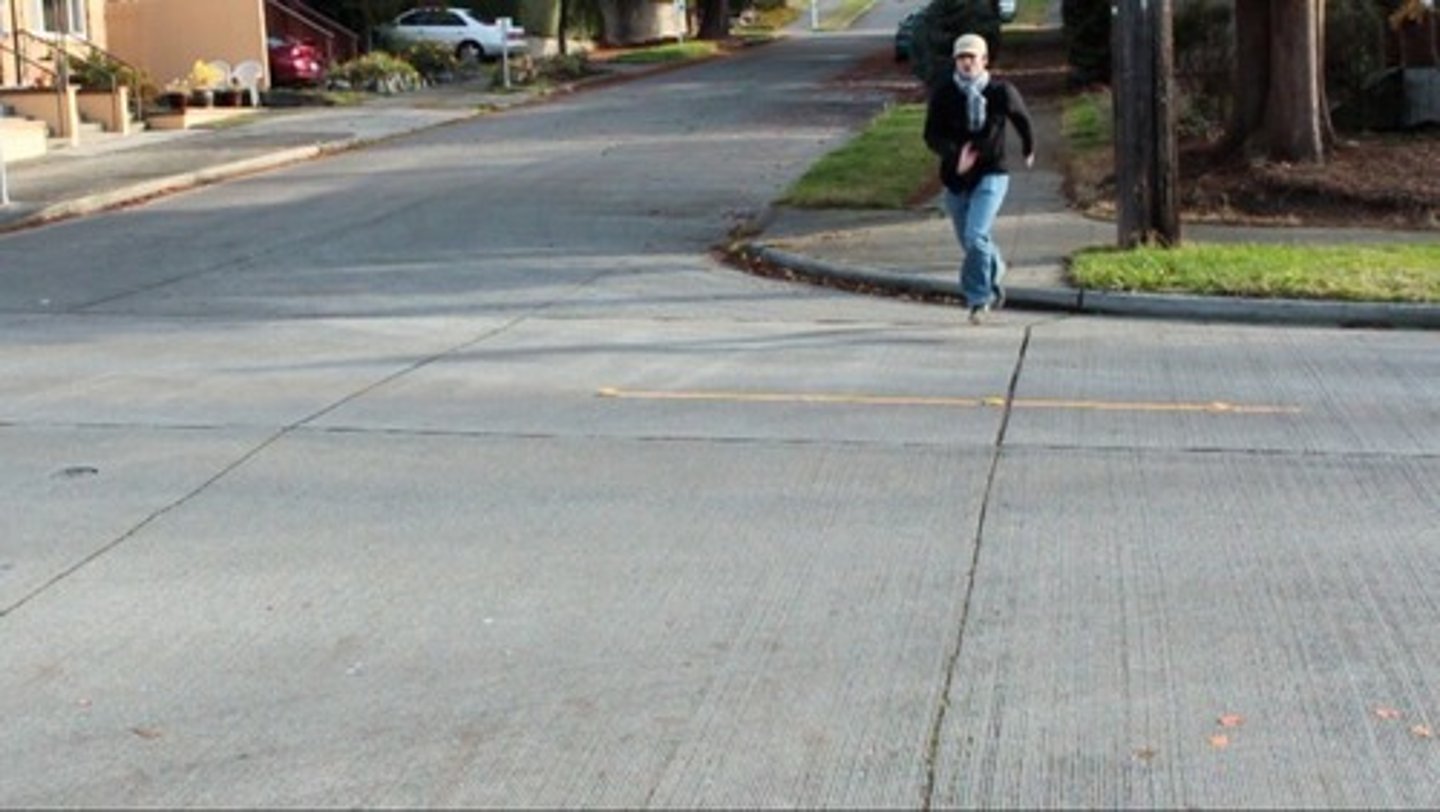 <p>In an unmarked crosswalk</p>