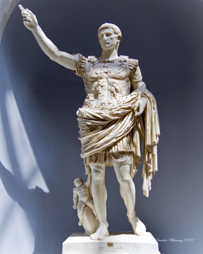 <ul><li><p><u><strong>Form</strong></u></p><ul><li><p>Contrapposto.</p></li><li><p>References Polykleitos’s Doryphoros.</p></li><li><p>Characteristic of works depicting Augustus is the part in the hair over the left eye and two locks over the right.</p></li><li><p>Heroic, grand, authoritative ruler; over life-size scale.</p></li><li><p>Back not carved; figure meant to be placed against a wall.</p></li><li><p>Oratorical pose.</p></li></ul></li><li><p><u><strong>Function and Original Context</strong></u></p><ul><li><p>Found in the villa of Livia, Augustus’s wife; may have been sculpted to honor him in his lifetime or after his death (Augustus is barefoot like a god, not wearing military boots).</p></li><li><p>May have been commissioned by Emperor Tiberius, Livia’s son, whose diplomacy helped secure the return of the eagles; thus it would serve as a commemoration of Augustus and the reign of Tiberius.</p></li></ul></li><li><p><u><strong>Content</strong></u></p><ul><li><p>Idealized view of the Roman emperor, not an individualized portrait.</p></li><li><p>Confusion between God and man is intentional; in contrast with Roman Republican portraits.</p></li><li><p>Standing barefoot indicates he is on sacred ground.</p></li><li><p>On his breastplate are a number of gods participating in the return of Roman standards from the Parthians; Pax Romana.</p></li><li><p>Breastplate indicates he is a warrior; judges’ robes show him as a civic ruler.</p></li><li><p>He may have carried a sword, pointing down, in his left hand.</p></li><li><p>His right hand is in a Roman orator pose; perhaps it held laurel branches.</p></li><li><p>At base: Cupid on the back of a dolphin—a reference to Augustus’s divine descent from Venus; perhaps also a symbol of Augustus’s naval victory over Mark Antony and Cleopatra.</p></li><li><p>Maybe a copy of a bronze original, which probably did not have the image of Cupid.</p></li></ul></li></ul>