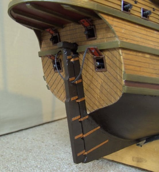 <p>A small piece of wood that controls the sailing direction of a ship</p>