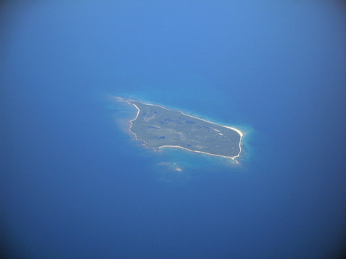 <p>an area of land completely surrounded by water</p>