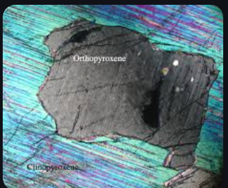 <p>colorless pink—&gt;green, 2 planes of cleavage, moderate to high relief, weak pleochromism, 1st order birefringence with parallel extinction, and fine twinning </p>