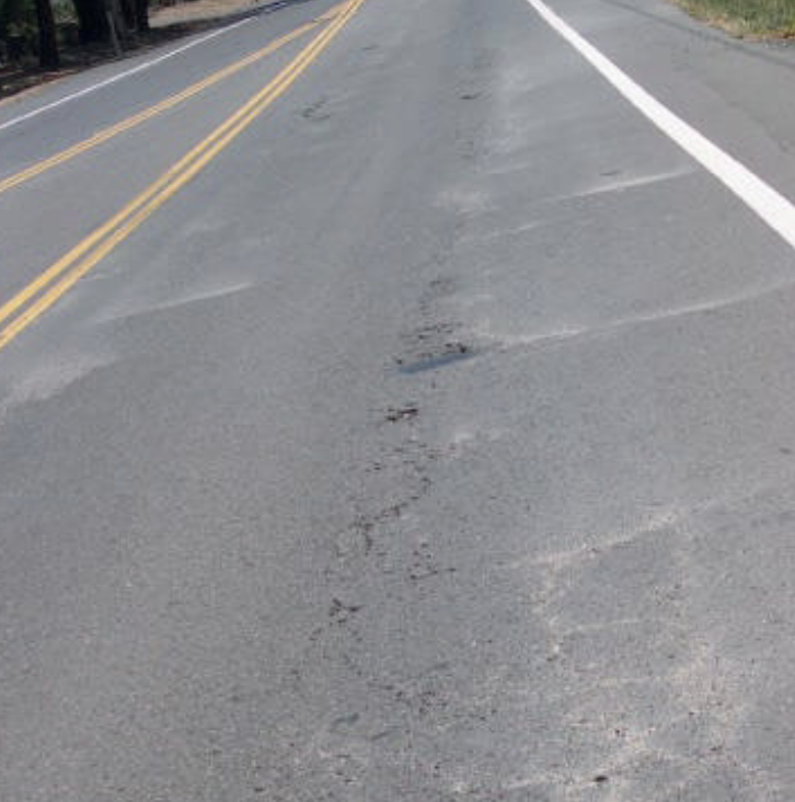 <p>water and fine material is ejected from underlying layers by moving loads</p>