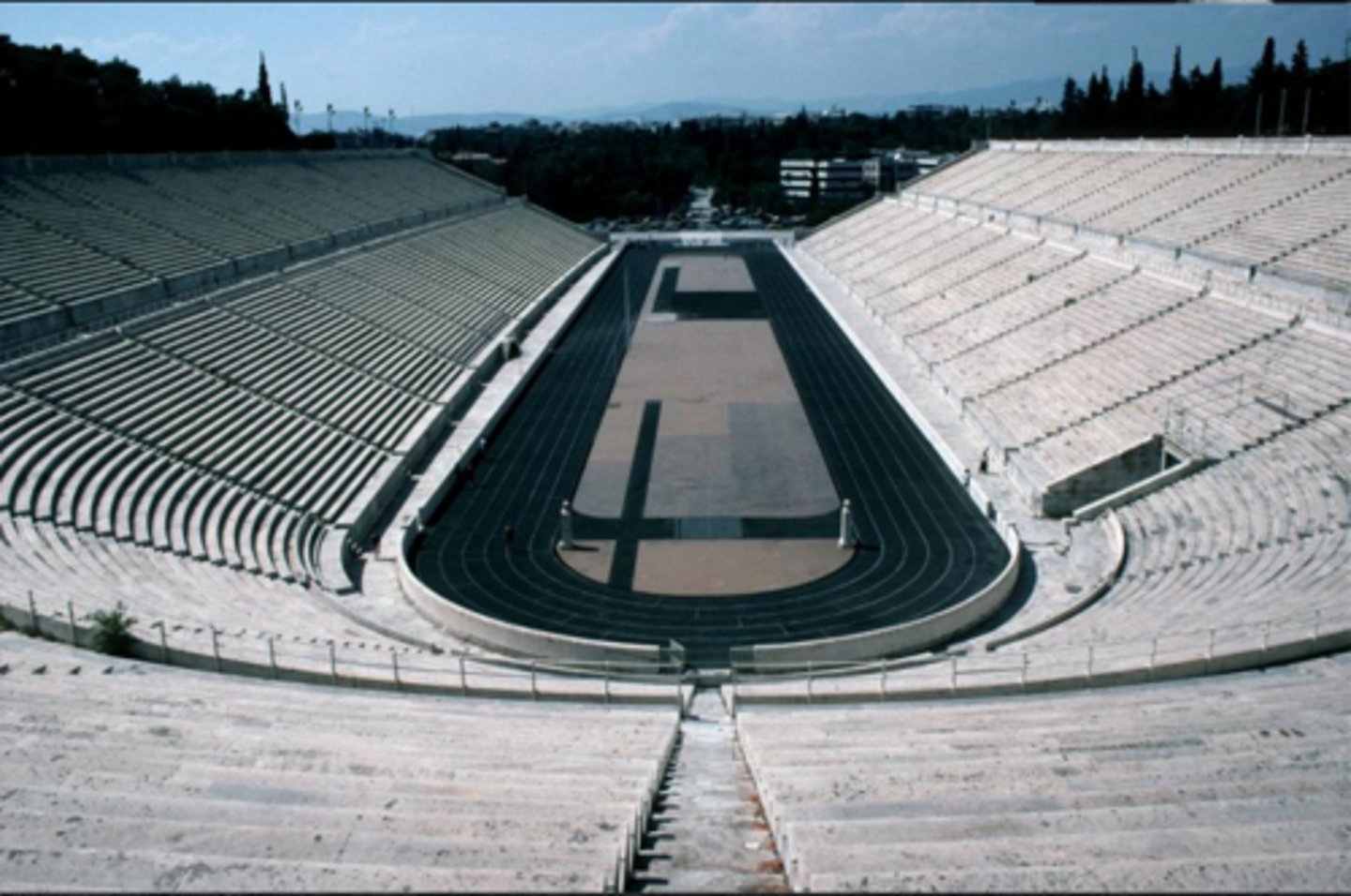 <p>Made entirely of marble, Long, narrow, horseshoe shape. Relatively flat terrain. Rebuilt in modern times</p>