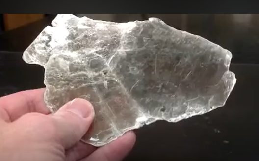 <p>White Mica </p><p>One direction of perfect cleavage </p><p>Clear </p><p>Pells off into thin sheets </p>