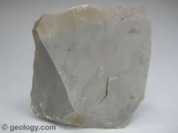 <p>Sedimentary, not made up of other rocks, waxy feel, conchoidal fracture, no visible crystals</p>