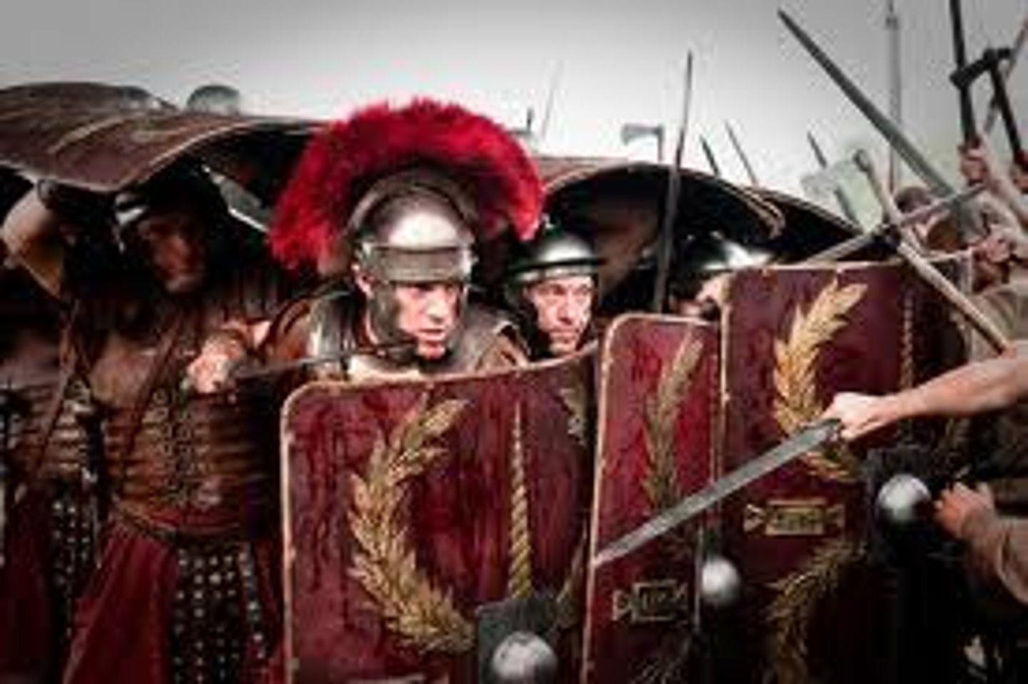 <p>carrying a lot of weapons/ involving the use of weapons</p><p>Eg: The terrorists are heavily armed.</p>